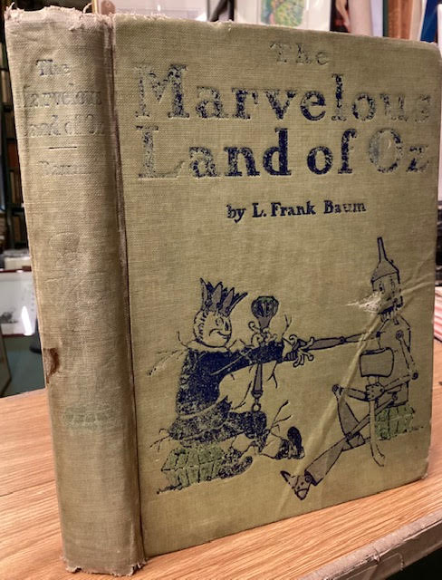 The Marvelous Land of Oz Being an account of the further adventures of the Scarecrow and Tin Woodman and also the strange experiences of the Highly Magnified Woggle-Bug, Jack Pumpkin-head, the Animated Saw-Horse and the Gump; the story being the Sequel to the Wizard of Oz